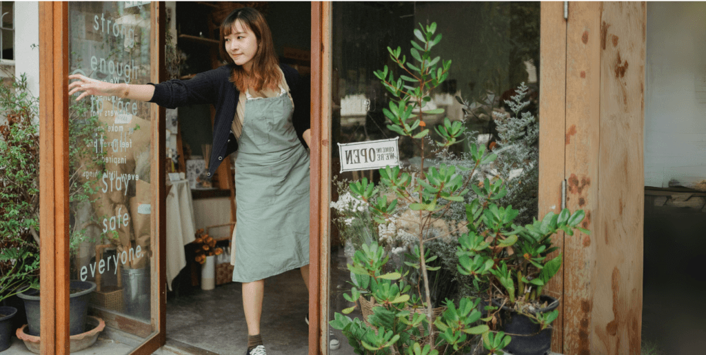 Sarah at her plant nursery storefront
